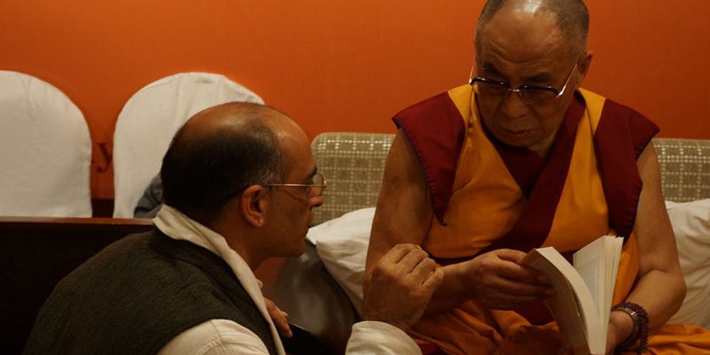 With His Holiness The Dalai Lama, offering the book Planting Seeds: Practicing Mindfulness with Children.